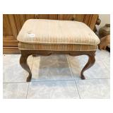 OTTOMAN TURNED CARVED LEG W/ STRIPPED UPHL.