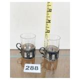 TWO SHOT GLASSES WITH STERLING BASES ONE GLASS IS