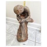 CHERUB LOOKING AT HIS FOOT