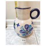 POTTERY PITCHER W/ FLOWER DESIGN APPLIED HANDLE