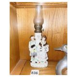 FIGURAL OIL LAMP W/ LANTERN CENTER
