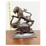 BRONZE FIGURE OF LION STANDING ON ELEPHANT -