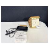 TRAVEL CLOCK, BACK ZIPPER ASSISTANT