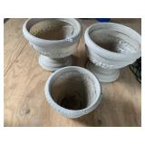THREE PLASTIC PEDESTAL URN PLANTERS