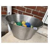 TIN FILLED WITH GOLF BALLS AND OTHERS