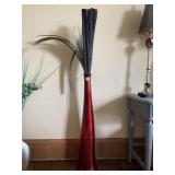 39" HIGH RED GLASS VASE WITH ARTIFICIAL LEAVES