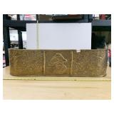 BRASS FIREPLACE FENDER WITH BOYS FACE AND FLOWERS