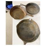 THREE CAST IRON SKILLETS
