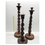 TWISTED WOOD BASE CANDLE STICKS ONE W/ CRACK ON