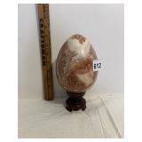 LARGE MARBLE EGG ON WOOD PEDESTAL