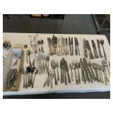 LARGE ASSORTMENT OF SILVERWARE AND SERVING PIECES