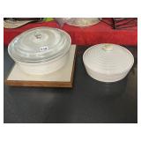 TWO COVERED CASSEROLE DISHES ONE HAS CHIP