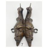 CAST IRON STYLIZED FACES JOINED TOGETHER 11" X 8"