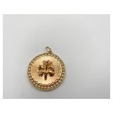 14K GOLD PENDANT - 1.25" D W/ FLOWER CENTER AND