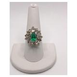 14K GOLD SETTING W/ GREEN CENTER STONE AND FAUX