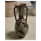 DOUBLE HANDLED POTTERY VASE WITH SIGNIFICANT