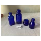 DARK BLUE GLASS VINTAGE APOTHECARY BOTTLES,