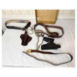 2 SETS OF HAND CUFFS AND LEATHER HOLSTERS