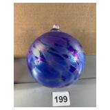 TO BLOW GLASS ORNAMENTS ONE LOOKS TO BE