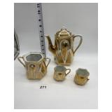 PORCELAIN GOLD LUSTER TEAPOT, TWO COPS ONE