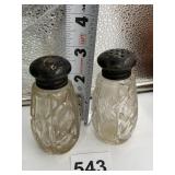 TWO SALT AND PEPPER SHAKERS WITH STERLING LIDS