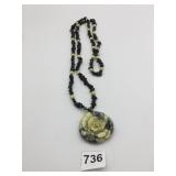 CARVED STONE FLOWER PENDANT BLACK STONE CHIP