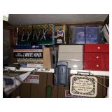 ITEMS ON SHELF, LYNX SIGN, BOOKS, LITTLE DRAWERS