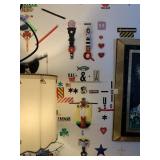 ITEMS HANGING ON WALL NEXT TO LAMP IN LIVING ROOM