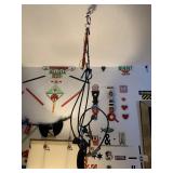 ITEMS ON LIVING ROOM WALL NEAR COUCH, COLLAGE ART