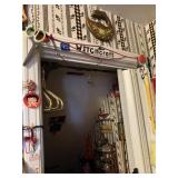 TRINKETS AND BUNGEES ON DOOR FRAME TO BASEMENT