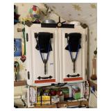 ITEMS HANGING ON BATHROOM CABINET, ON TOP AND ON