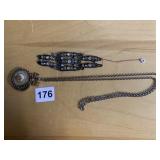 SEQU BELT BUCKLE , NECKLACE WITH MAGNIFIER