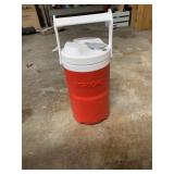 RED PLASTIC BEVERAGE COOLER WITH WHITE SPIGOT AND