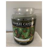 GLASS JAR WITH METAL LID CONTAINING DARK GREEN