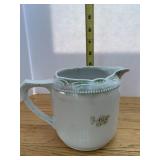MARKED GERMANY WHITE PORCELAIN MUG WITH MOLDED