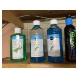 FOUR PLASTIC BOTTLES OF AFTER-SUN CARE PRODUCTS;