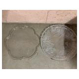 TWO CLEAR PRESSED GLASS SERVING PLATES OR TRAYS.