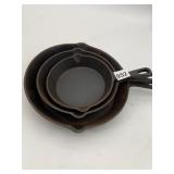 NESTED CAST IRON FRYING PANS, SKILLETS.