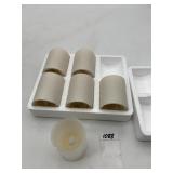FLAMELESS LED PILLAR CANDLES IN FOAM PACKAGING.