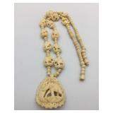CARVED NECKLACE POSSIBLY BONE ELEPHANTS