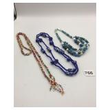 BEADED NECKLACES BLUE  BEADS WITH FACES MULTI