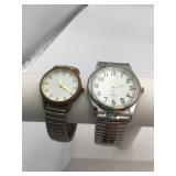 TWO SILVER TONE WRISTWATCHES STRETCH BANDS