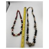 TWO BEADED NECKLACES BLACK/TAN W/ GOLD TONE