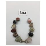 BRACELET WITH APPLIED NATURAL STONE PIECES NEEDS