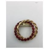 PIN DOUBLE CIRCLE GOLD TONE AND RED RHINESTONES