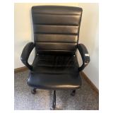 BLACK EXECUTIVE OFFICE CHAIR, RIBBED CUSHIONING,