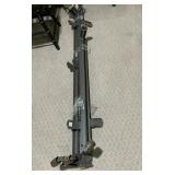 METAL ADJUSTABLE BED FRAME W/ WHEELS.