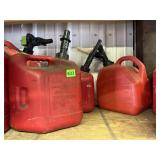 RED PLASTIC GASOLINE CANS W/ SPOUT TOPS.