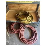 ASSORTED RUBBER HOSES, RED AND YELLOW.