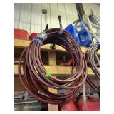 COILED RED HOSE, INDUSTRIAL GRADE, W/ FITTINGS.